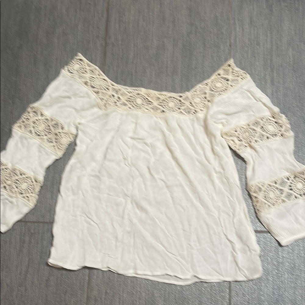 Beautiful top m with lace features throughout . Never worn